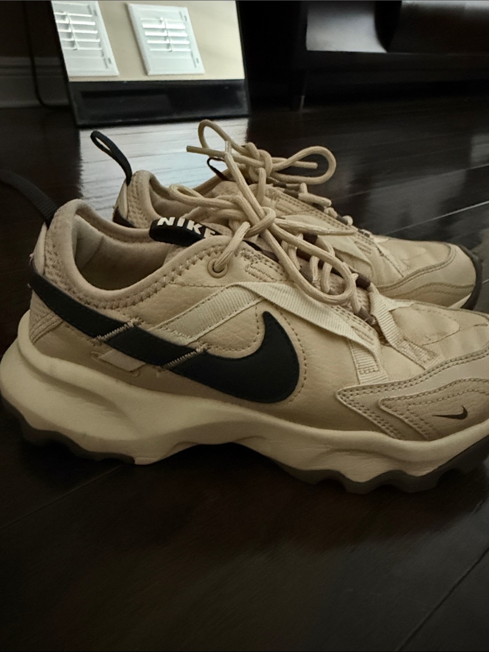 Nike Women's Cream Sneakers with Black Swoosh